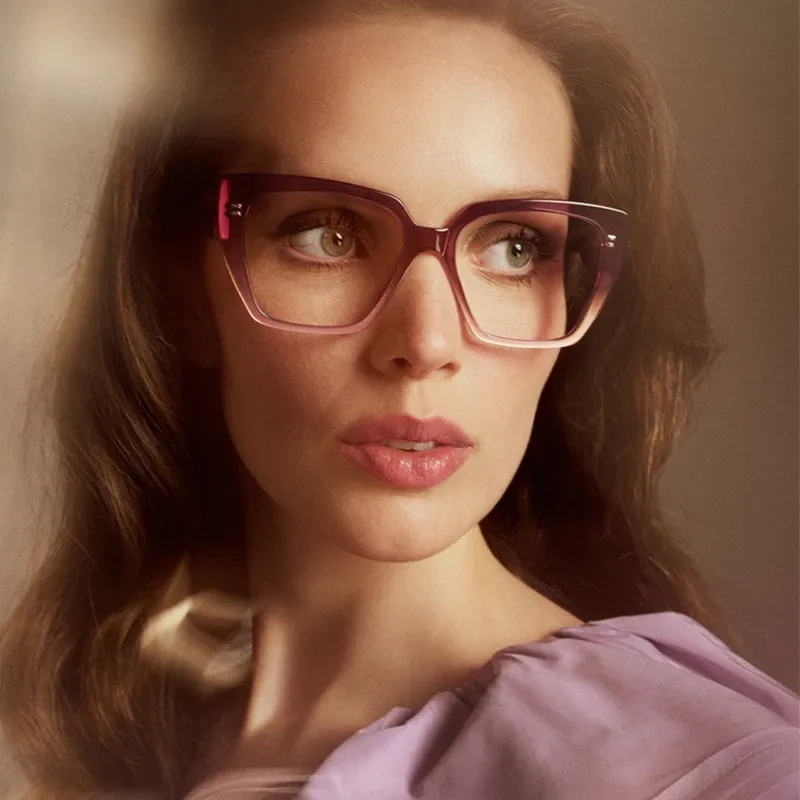 Wearing the purple eyewear model Andromeda in a soft setting